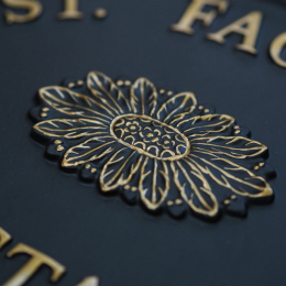 Gold Emblem Close Up house sign