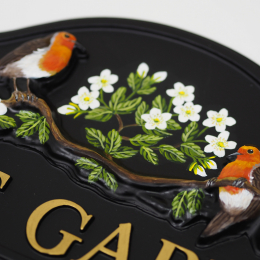 Robins On Branch close-up. house sign