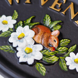 Mouse In Flowers close-up. house sign
