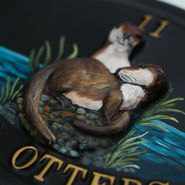 Otters Close Up house sign