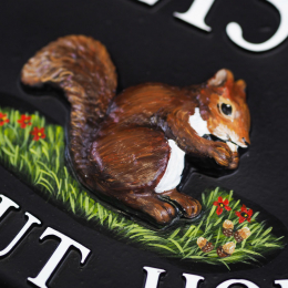 Squirrel With Acorns Close Up house sign