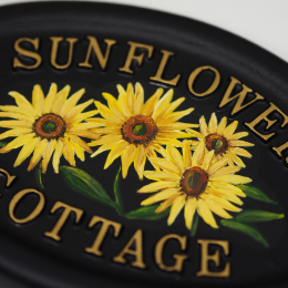 Sunflowers close-up. house sign