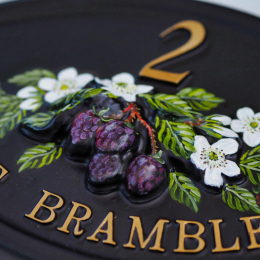 Brambles close-up. house sign