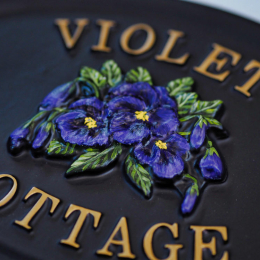 Violets Split close-up. house sign